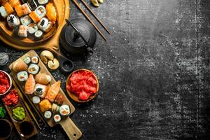 An assortment of different types of sushi and rolls. photo