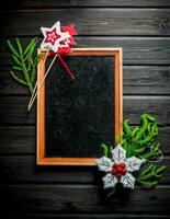 Empty Christmas frame with fir branches. photo