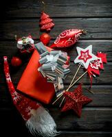 Red gift box with Christmas decorations. photo