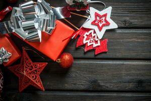 Red Christmas boxes with bow and Christmas decorations. photo