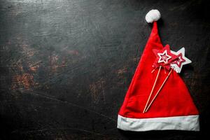 Red Christmas hat with Christmas decorations. photo