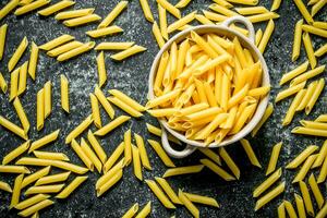 Pasta background. Dry the pasta in the pan. photo