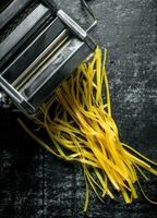 Machine for cooking homemade pasta. photo