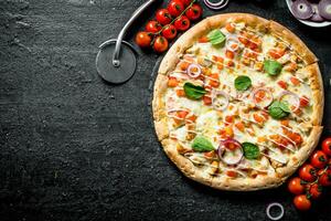 Pizza with tomatoes on a branch. photo