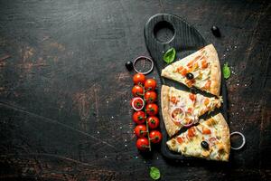 Fragrant slices of pizza on a cutting Board. photo