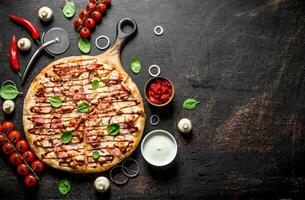 Barbecue crispy pizza with bacon. photo