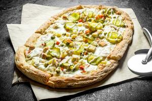 Pizza with cucumbers and cheese sauce. photo