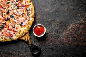 Fragrant pizza with seafood. photo