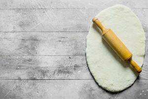 Round rolled dough for homemade pizza. photo