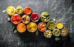 Preserved food in glass jars. photo