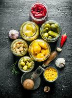 Pickled vegetables in glass jars. photo