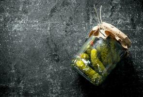 Pickles in a glass jar. photo