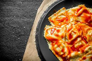 Ravioli with tomato sauce. photo