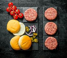 Raw burgers. Cooking of beef Burger patties. photo