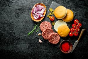 Raw burgers. Cooking of beef Burger patties. photo