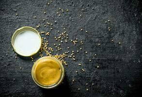 Mustard in a glass jar. photo