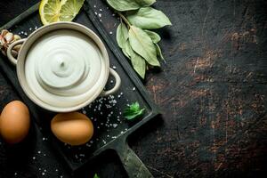 Mayonnaise with Bay leaf, eggs and garlic. photo
