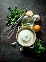 Mayonnaise with herbs, oil and garlic. photo