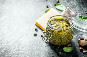 Pesto sauce with pine nuts, cheese and garlic. photo