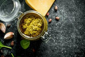 Pesto sauce with pine nuts, cheese and garlic. photo