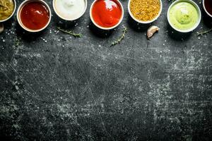 Set of different flavorful sauces. photo