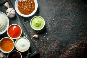 Set of different types of sauces. photo