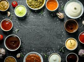 Variations of different types of sauces in bowls. photo