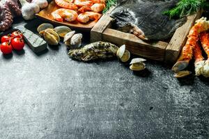 Flounder fish on tray with crab, shrimp and oysters. photo