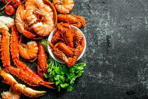 Cooked shrimp, crayfish and crab with parsley. photo