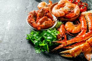 Cooked shrimp, crayfish and crab with parsley. photo