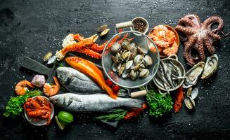 Seafood. Fresh fish with oysters in colander, crab, octopus, shrimp and crayfish. photo