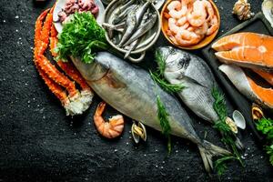 Salmon steak on a cutting Board with seafood. photo