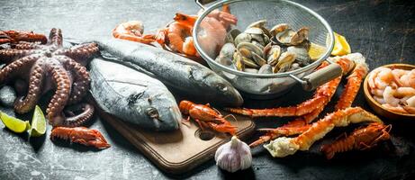 Seafood. Oysters, fresh fish, shrimp, octopus and crab with lemon slices. photo