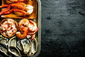 Seafood. Oysters, shrimp and crab on tray. photo