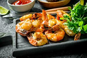 Freshly cooked shrimps with parsley. photo