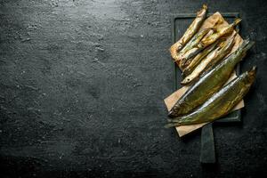 Smoked fish on the cutting Board. photo