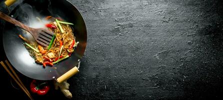 Fragrant Chinese funchoza with fresh vegetables. photo