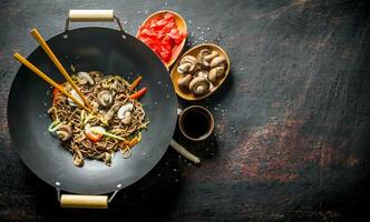 Ready soba noodles with ginger, mushrooms and soy sauce. photo