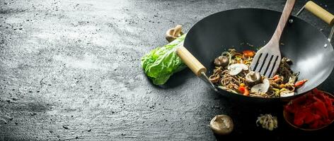 Fragrant soba noodles in a wok pan. photo