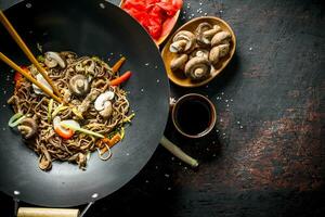 Ready soba noodles with ginger, mushrooms and soy sauce. photo