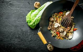 Fragrant soba noodles in a wok pan. photo