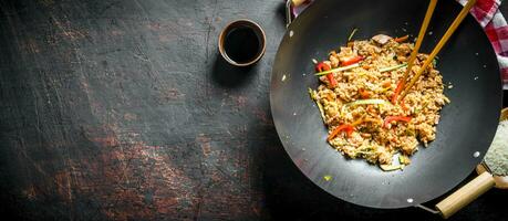 Fragrant wok rice with chicken and vegetables. photo