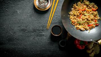 Wok rice with spices, soy sauce and bell pepper. photo