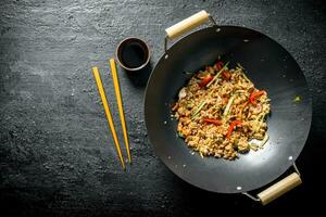 Fragrant wok rice with chicken and vegetables. photo