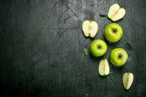 Green apples with leaves. photo