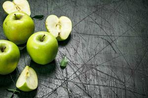 Green apples with leaves. photo