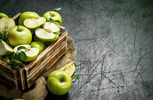 Green apples in an old box. photo