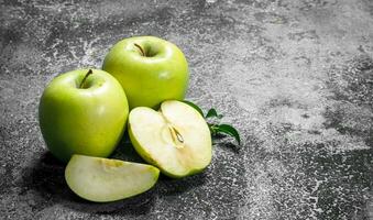 Green apples with leaves. photo