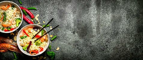 Asian food. Chinese noodles with vegetables and shrimp. photo