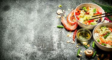 Asian food. Chinese noodles with vegetables and shrimp. photo